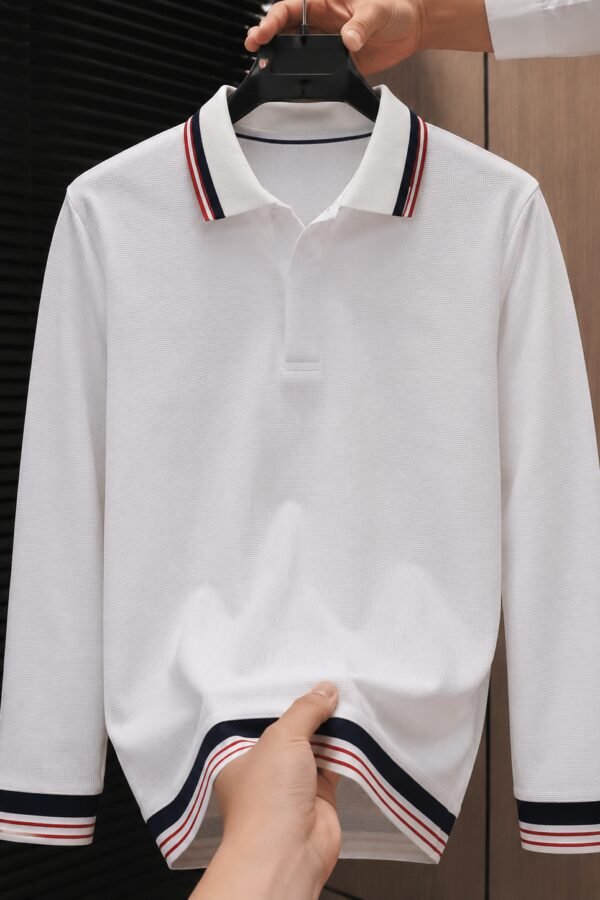 Men's white full sleeve polo t-shirt with navy blue and red striped collar, cuffs and hem