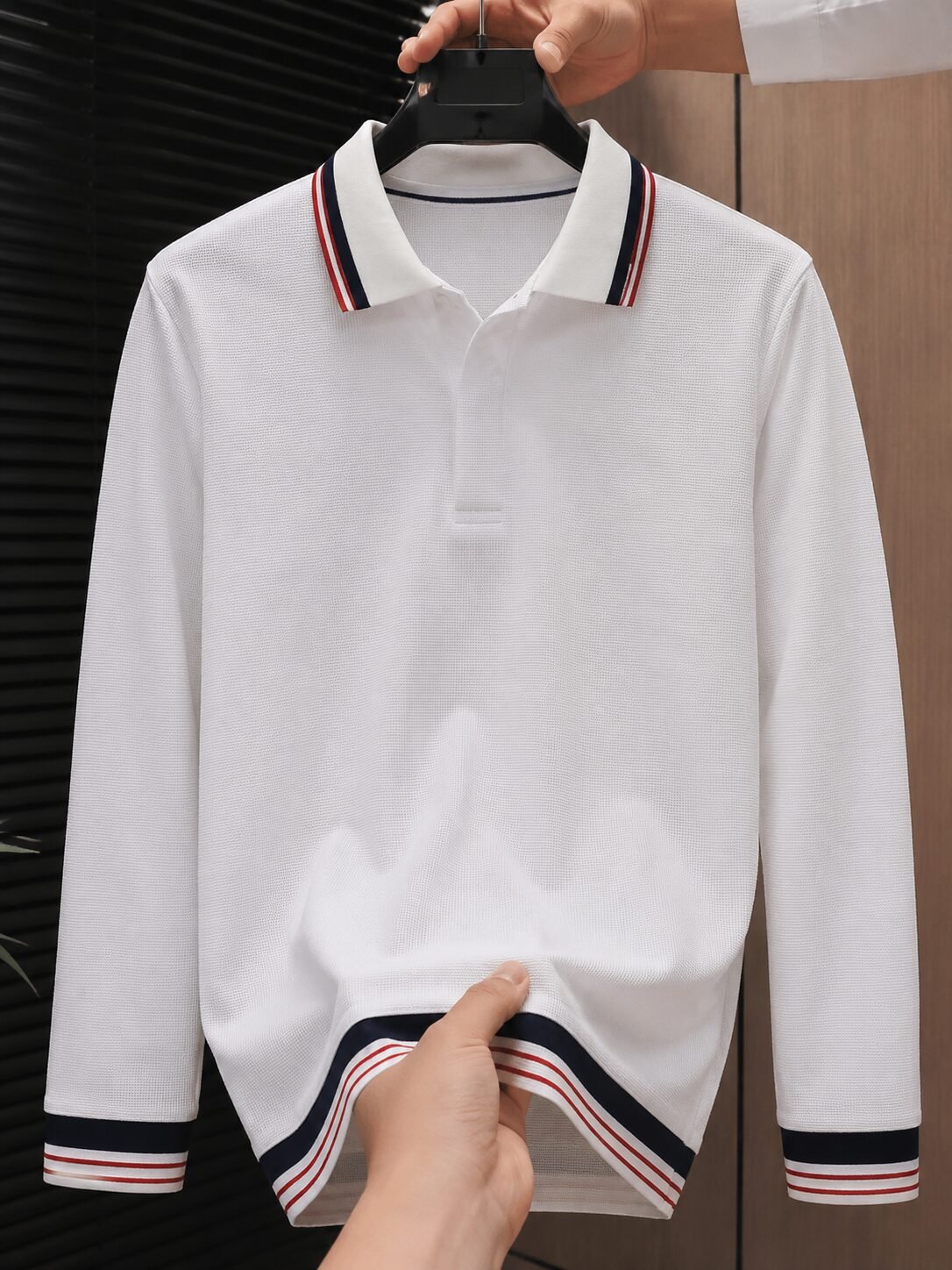 Men's white full sleeve polo t-shirt with navy blue and red striped collar, cuffs and hem