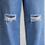 Close-up of knee rips on light blue baggy jeans for men – Arshmee Fashion