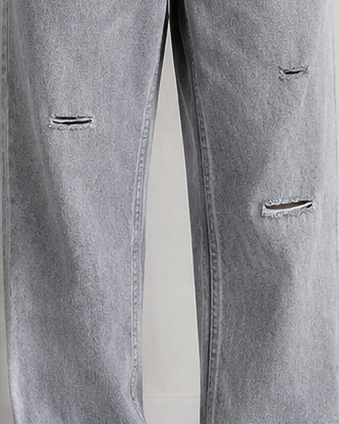 Close-up of distressed rips on grey baggy jeans for men – Arshmee Fashion